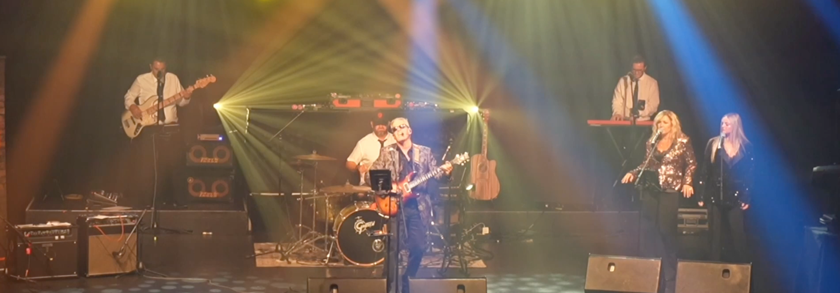 Groove Dr B and full band performing live on stage